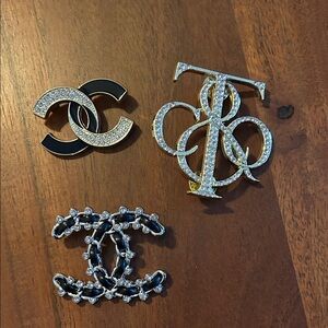 Black, Gold, and Silver Brooch Trio